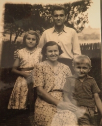With his parents and sister
