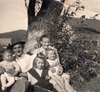 The Pavelka family in Záblatí, Marie on her mother's lap (1948)