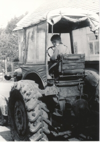 On a tractor during summer holidays in Zderaz, 1966 