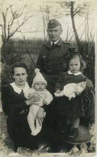 Father (33), mother (31), Erika (2) and brother Manfred (less than 1). In their garden in Velký Tábor, Silesia, during father's military leave
