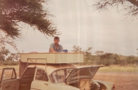 Jiří Pechouš on the roof of a car at the place where the family set up a tent while camping, the 1970s	