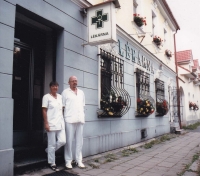 With his wife and colleague Ludmila in front of the pharmacy building in Jesenice, 2005
