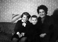With her mother and brother, 1950s 
