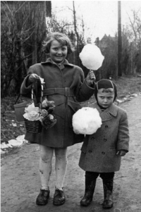 With her brother, Pepíček, visiting a fair, 1950s 


