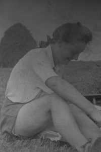 Ludmila Ševčíková having a snack in a field in the late 1940s.