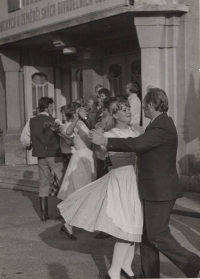 Dancing with the chairman of the show's preparatory committee at the welcome in front of the theatre as a member of the dance group, 1982
