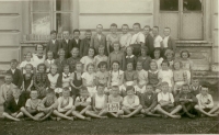 Libuše (second row, centre, with plaited hair), in the third grade. Nová Ves 1936