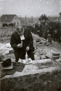 Inserting a bottle into the foundation of the church in Chotiněves (Jaroslav Opočenský) in 1951
