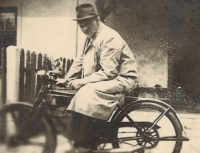 The witness's father František Stránský sr. on the moped on which he commuted to Pilsen, late 1930s