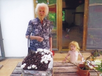 Marie Hromádková with her granddaughter and mushrooms, Kunčice 2019