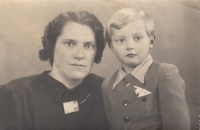 With his mother, around 1945 