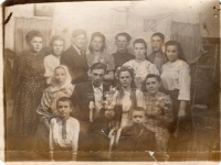 The wedding of Mykola Zakharkiv (second from the left side of the second row) and Tonia (Antonina) Shpilman (second from the right side of the second row); the first on the left side of the second row is Matrona Zakharkiv from the house of Dymkovychi; 1st row on the left - Oleksiy Zakharkiv, on the right - Kachan Yaroslav; 3rd row - from left to right: 3rd - Pakhomko, 5th - Antin Kuz, 6th - Mariya Zakharkiv, 7th - Fedir Zakharkiv, 8th - Melaniya (Mila) Zakharkiv. Siberia, village Novopestery (now - Novopesterovo), Kemerovo region, 1953

