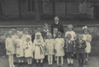 Přemysl Hořejší (in front of the parish priest) at Holy Communion in a German school during the war