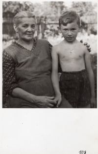 In the garden with his grandmother Jirková, 1943