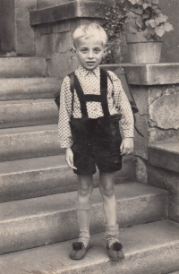 Bohuslav Holý on his first day of school, in front of his house, 1960