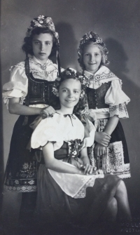 Zdenka standing on the left in national folklore costume with her friends, Prague, May 1945
