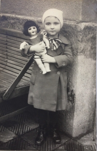 Zdenka with a doll in the yard, Prague 1936