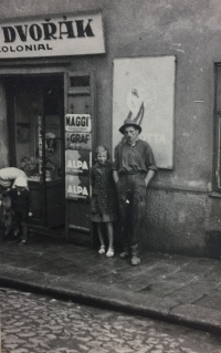 In the background of the photo the inscription "Koloniál [convenience shop] Dvořák"