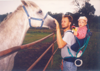 Tomáš Mitáček with his daughter Katerina, with horses in 1997