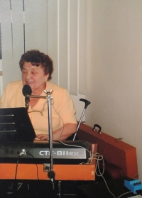 Marta Porubová playing electronic keyboard, 2005