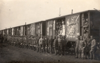 NCO school of the 6th Regiment at their wagons, Václav Vaněk Sr. standing in front of a wagon under an arrow, April 1918	