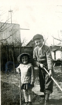 With her brother Jiří when working in the garden in 1942