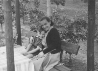 With his mother, 1955