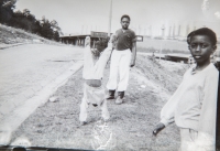 Children at the Fim Motel, with a housing estate in Považská Bystrica visible in the background