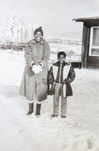 Josephine with one of the children in front of the Fim Motel