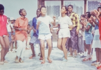 Children dancing in front of the Fim Motel