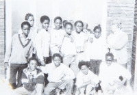 Children in the Fim Motel with one of the Slovak teachers