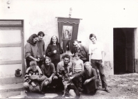 Tobiáš Jirous (standing, far right) next to Egon Bondy. Kostelní Vydří, 1986