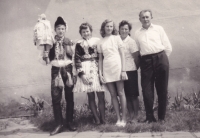 As the head of youth organization (with his sisters and parents) 