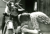 Dalibor Dědek repairing a motorcycle in the mid-1970s