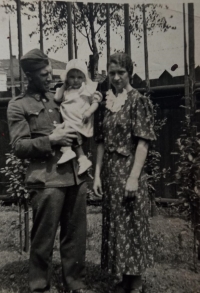 Marie Stárková with her parents, around 1936.