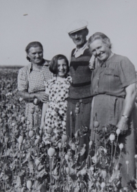 Marie with mother, grandmother, and grandfather, 1936