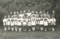 Jana Zachová (middle back in white dress) in 1st grade, 1940s