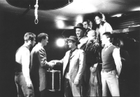 Jiří Lábus (in the middle of the group in a bowler hat) in the play Amerika, photograph by Vladimír Svoboda