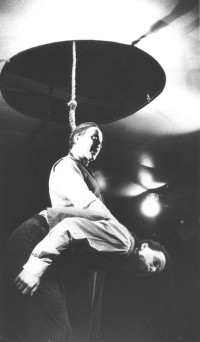 Jiří Lábus (with his head in a noose) in the play America, photograph by Vladimír Svoboda