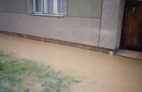 Floods, in front of their house, 1997