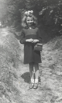 On her way from a church in Letařovice, around 1939 

