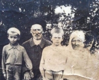 Great-grandfather Nikolai, great-grandmother Tatiana, and uncles Ivan and Anatoly in Novolabinskaya village in Kuban, 1940