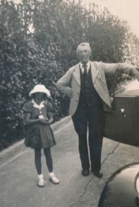 Karla Trojanová holding a guinea pig and her grandfather Jindřich Schwarz