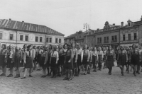 The ceremonial handing over of a Scout flag in Mladá Boleslav (the symbolic V on the house stands for Victoria - a symbol of German victory, but the Czechs used to say: You blockheads, do you really believe in the victory of your leader?), 1946