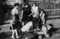 Marta Čechová (standing by the pram in the centre) with her first daughter, 1962