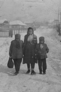 From the period of displacement in the Romanian town of Comanesti, Anna and two schoolchildren in the middle, circa 1952
