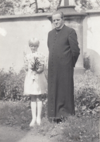 Priest Exner and daughter Marcela at the First Holy Communion, Hostinné, early 1980s
