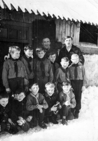 Boy Scout troop from Hrčava / the parish priest and scout leader Oldřich Prachař in the background/ around 1968