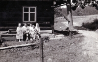 Jarmila Sikorová with her parents, younger siblings, grandmother and great-grandmother / Hrčava / around 1958