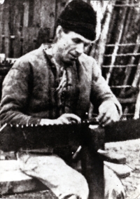 Jarmila Sikorová's grandfather sharpening a saw / Hrčava